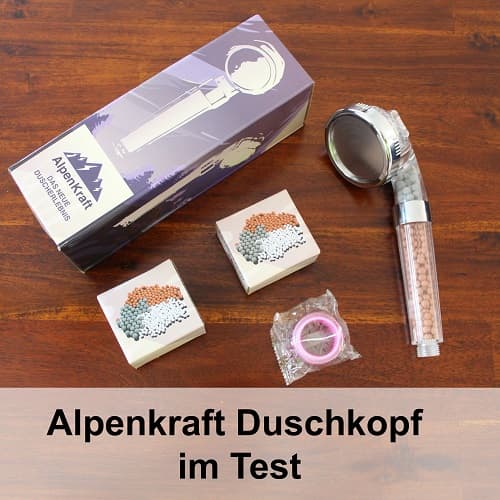 Alpenkraft Duschkopf auf Holztisch